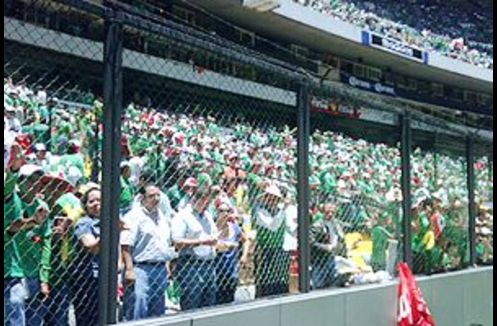 Image of Mexican fans behind a fence at a match