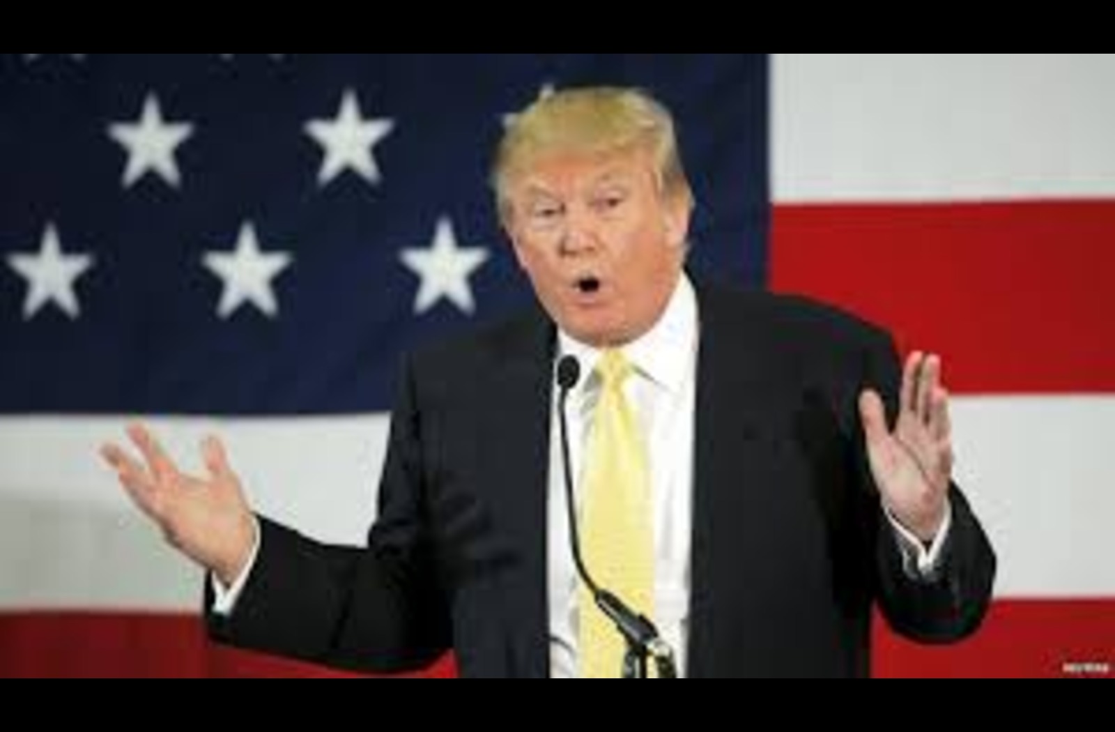 Trump makes speech in front of American Flag